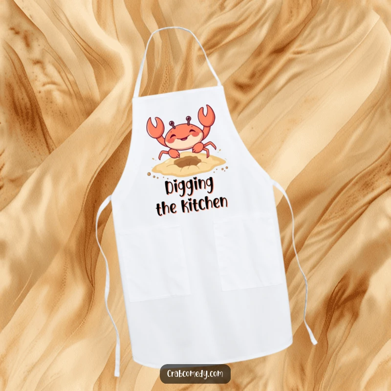 Funny apron for cooking with a crab digging in the sand, adding humor and beach flair.